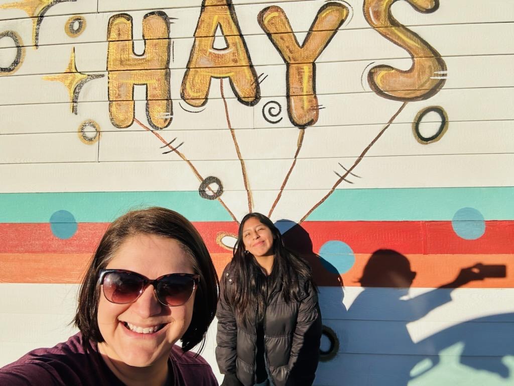 Andrea in front of Hays mural