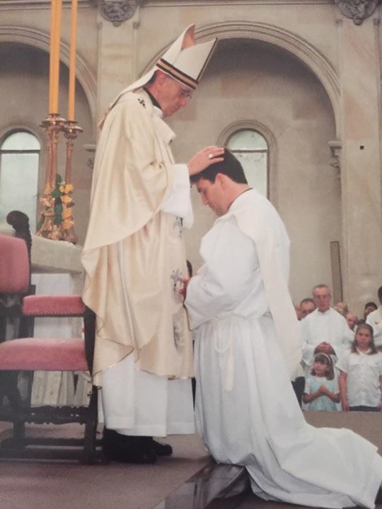 Then-Cardinal Jorge Bergoglio (Pope Francis) ordains Adolfo a priest during a ceremony in Buenos Aires, Argentina, on Nov. 10, 2001.