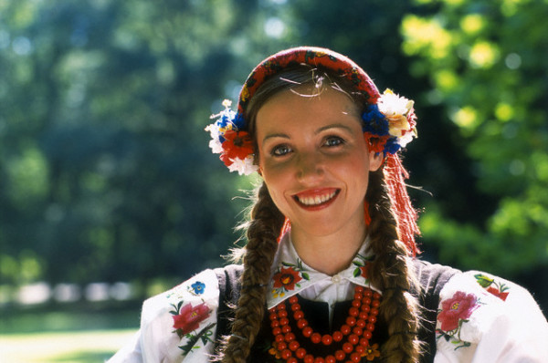 ca. 2005, Warsaw, Poland --- Young woman wearing a traditional costume from the Lowicz Region of Poland, at Royal Lazienki Palace and Gardens in Warsaw, Poland. Image by © Dallas and John Heaton/Free Agents Limited/Corbis