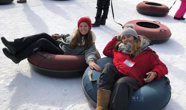students snow tubing