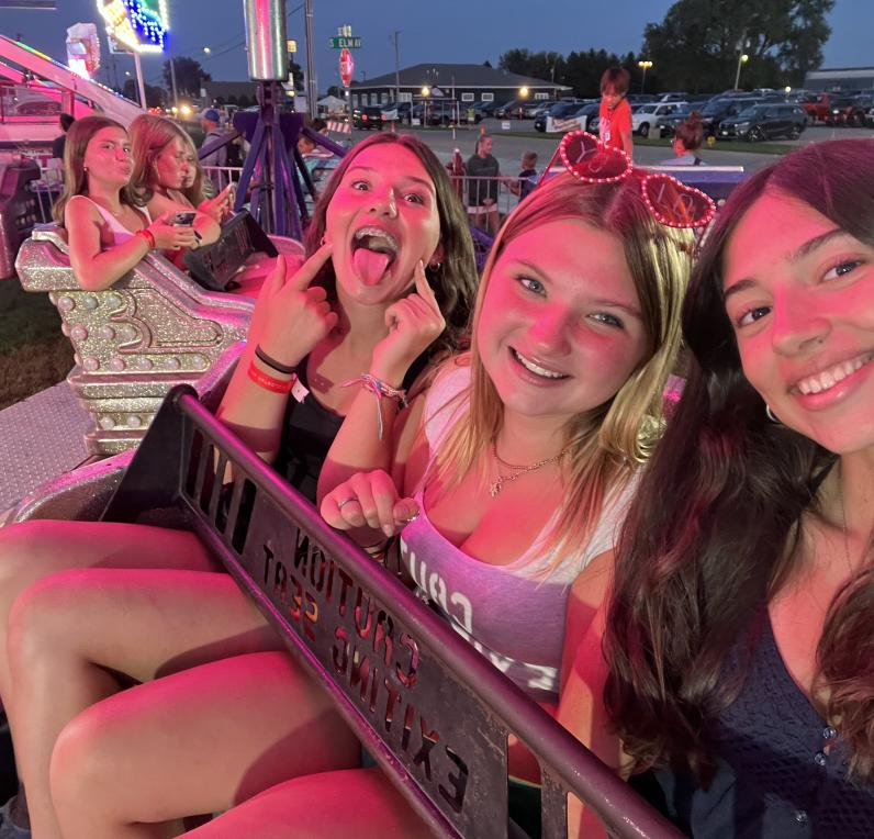 student & friends at amusement park