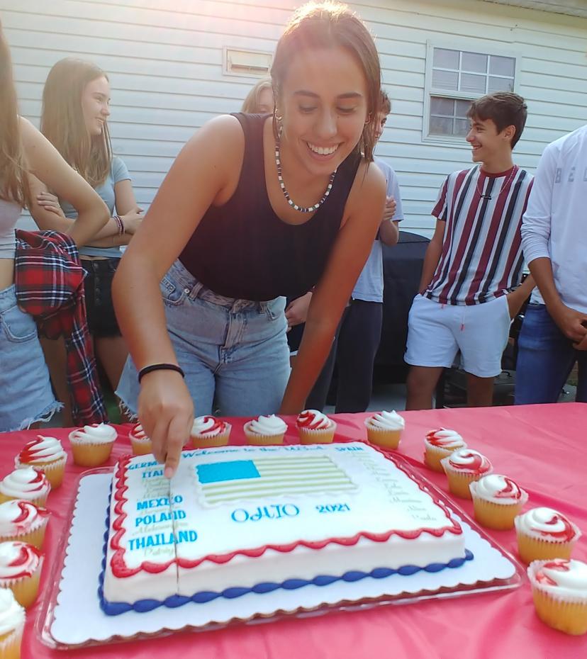 Orientation party cutting the cake